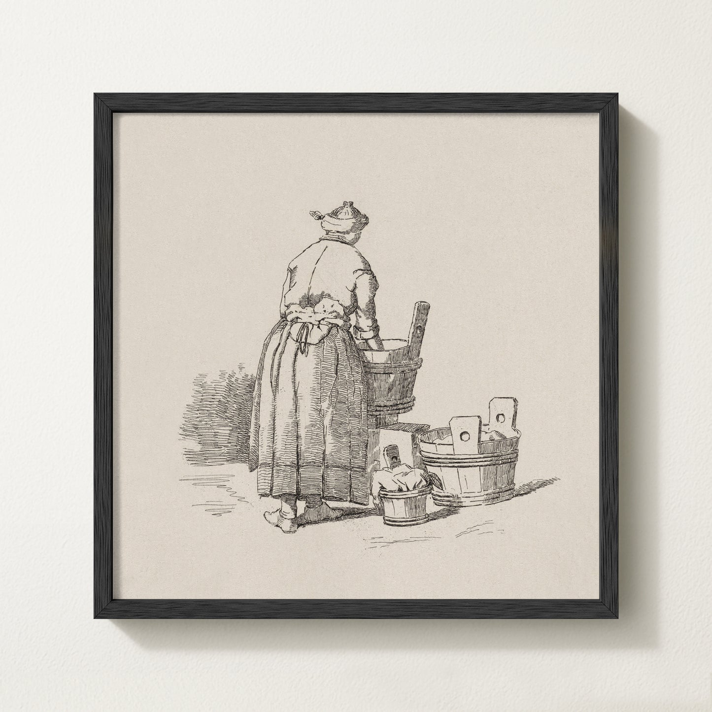 Framed vintage laundry sketch art print depicting a woman standing at wooden wash tubs in traditional attire.