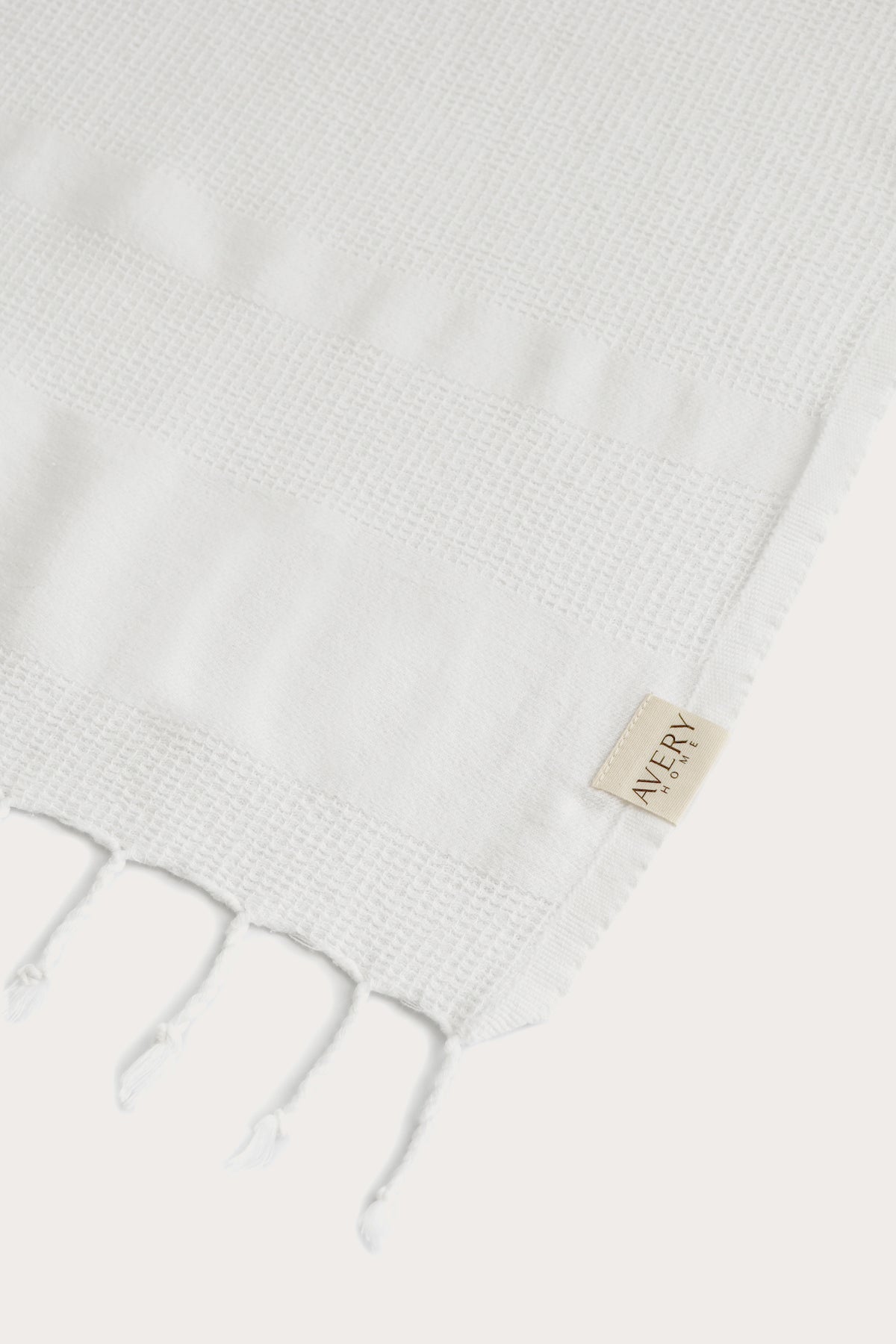 Avery Home white waffle weave peshtemal folded, fast-drying luxury Turkish hammam towel for spa, beach, and bath for men