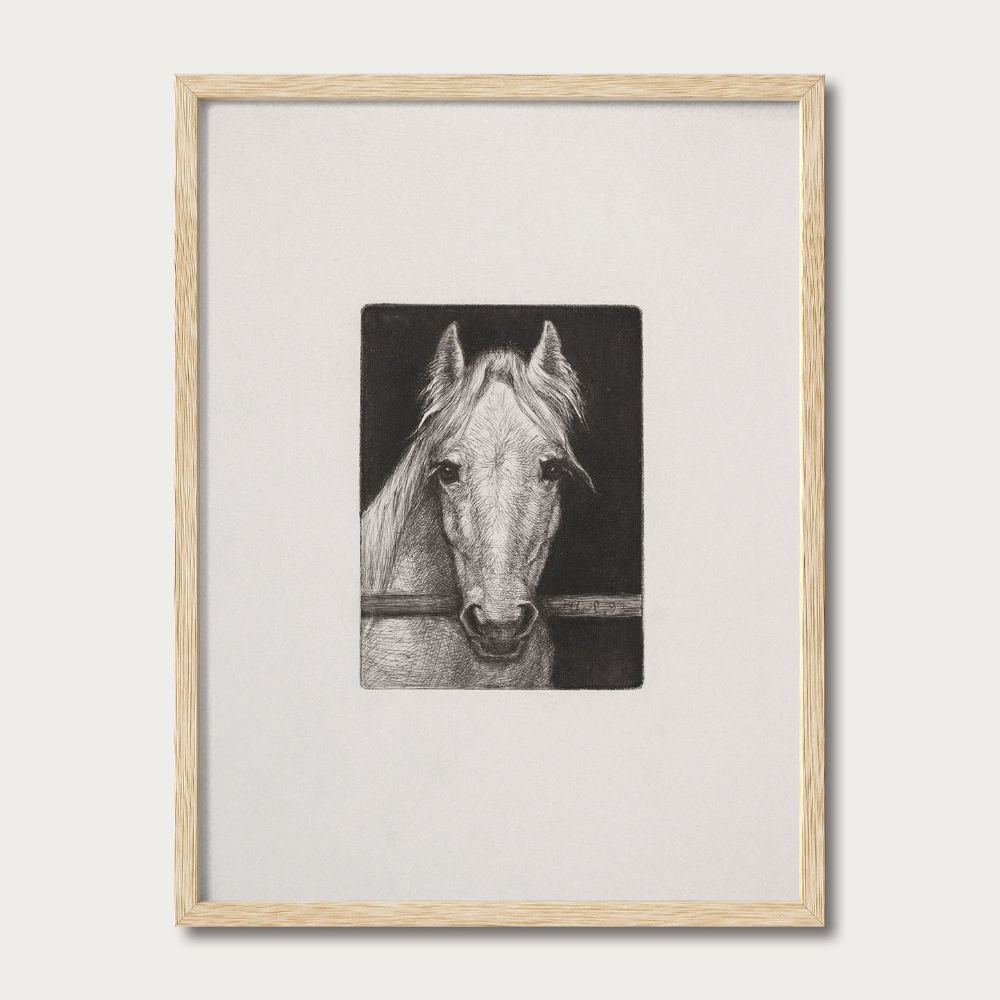 Black and white horse sketch framed in natural solid oak with a wide white mat