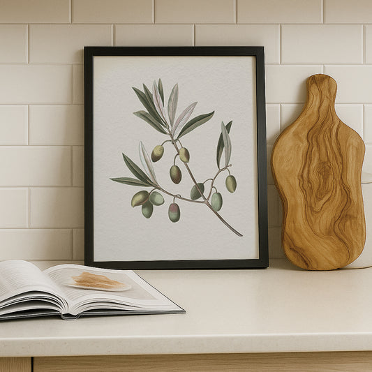 Vintage botanical artwork of an olive branch with black olives on a white background, in solid oak frame