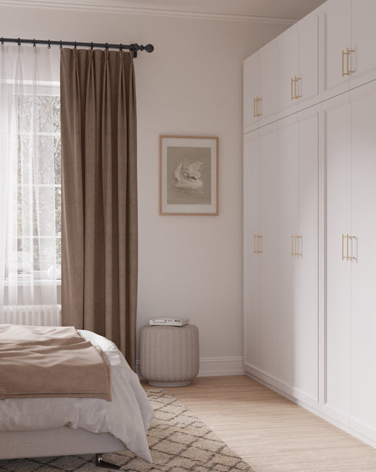 Framed vintage swan artwork styled in a softly lit neutral bedroom with elegant vintage-inspired decor.