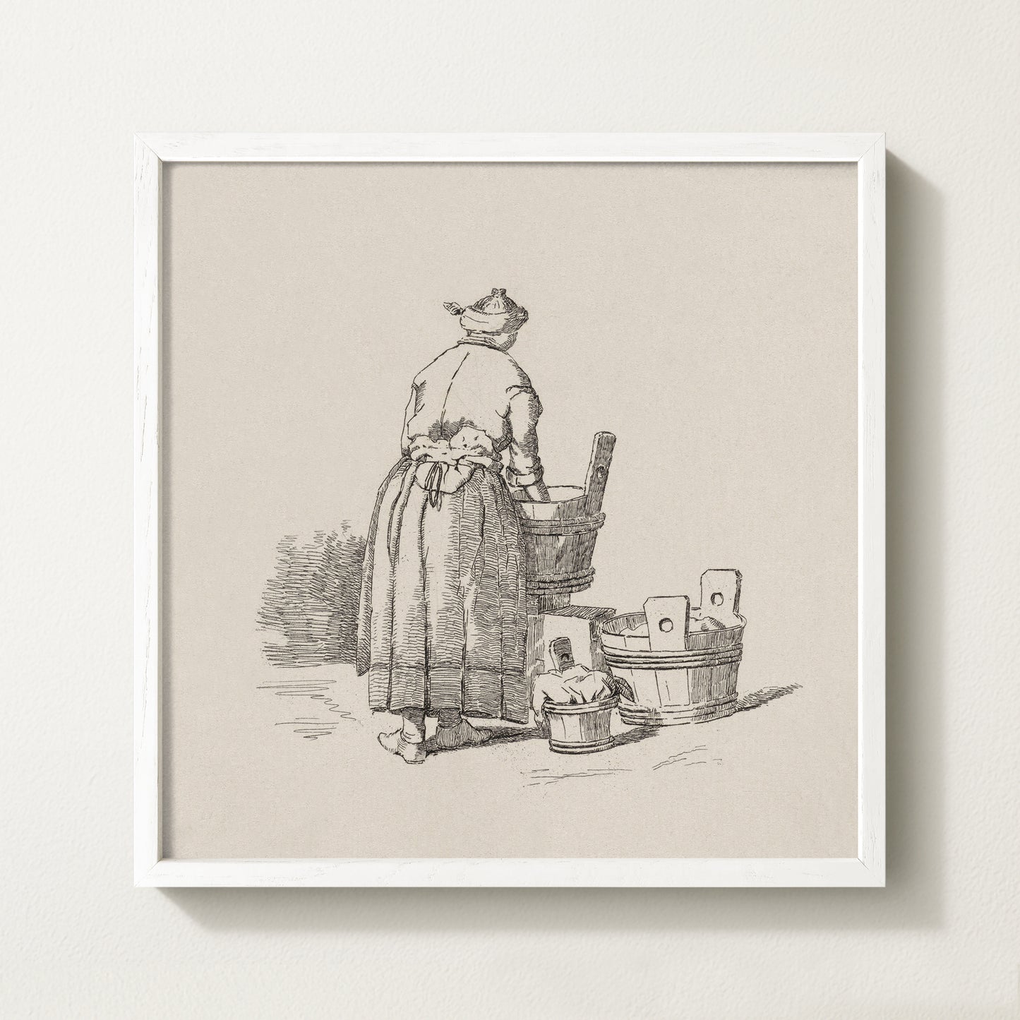Framed vintage laundry sketch art print depicting a woman standing at wooden wash tubs in traditional attire.