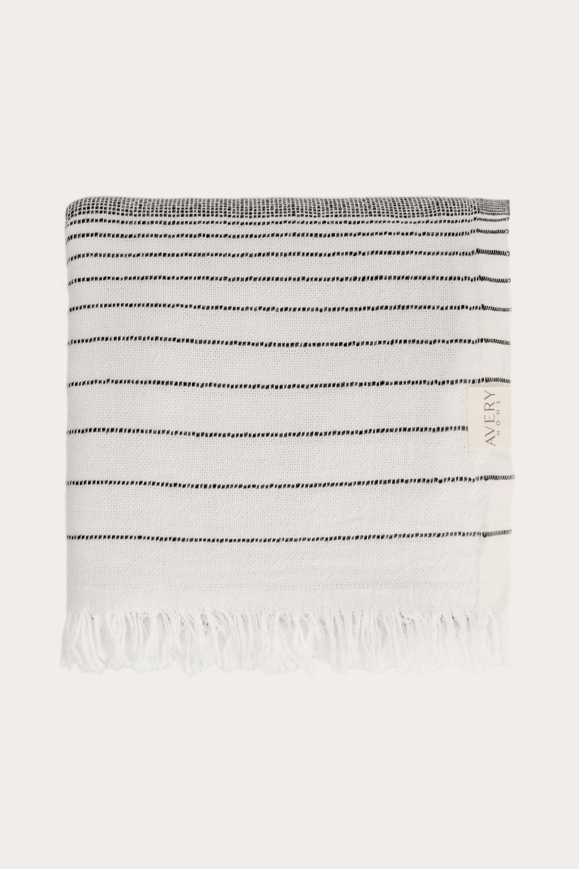 Avery Home black stripe peshtemal folded, sustainable Turkish towel in cotton, recycled cotton and recycled polyester blend, lightweight and fast-drying