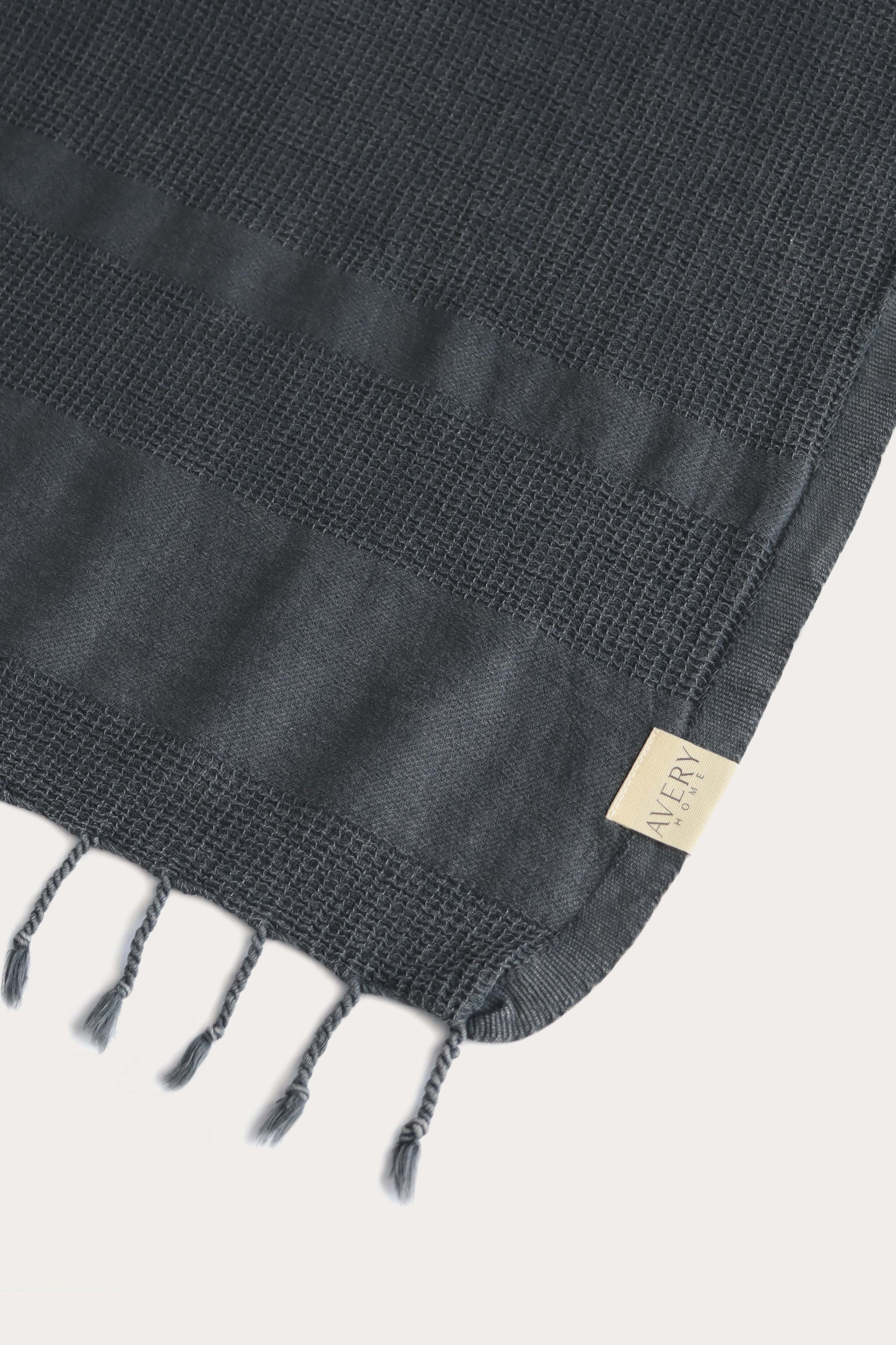 Avery Home dark gray waffle weave peshtemal folded – fast-drying luxury Turkish hammam towel for spa, beach, and bath for men