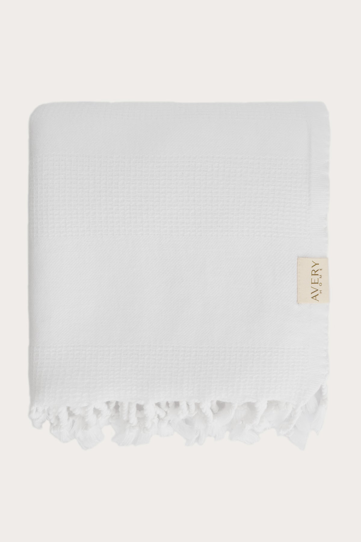 Avery Home white waffle weave peshtemal folded, fast-drying luxury Turkish hammam towel for spa, beach, and bath