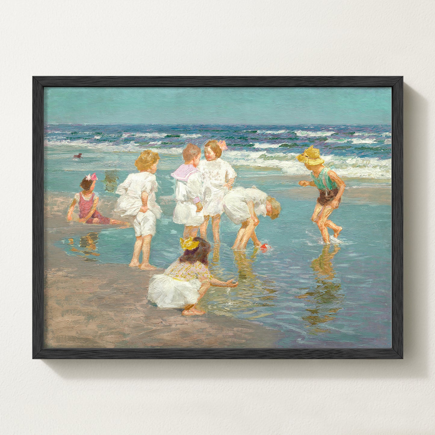 Framed vintage kids beach scene art print featuring children in white clothing playing by the shore with waves in the background.