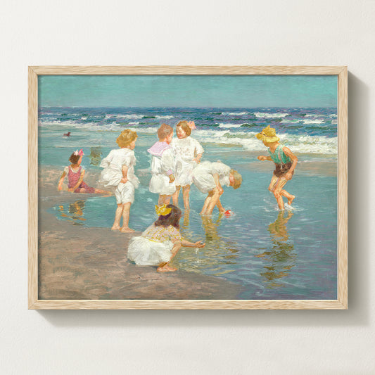 Framed vintage kids beach scene art print featuring children in white clothing playing by the shore with waves in the background.