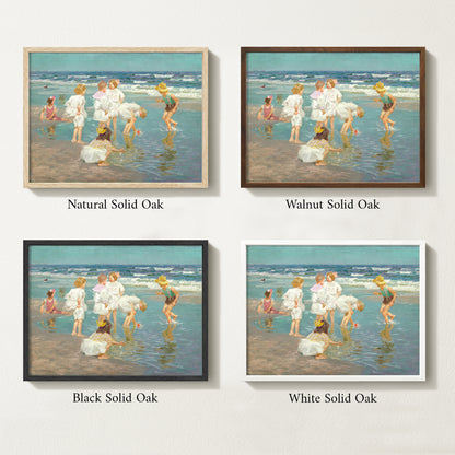 Framed vintage kids beach scene art print featuring children in white clothing playing by the shore with waves in the background.