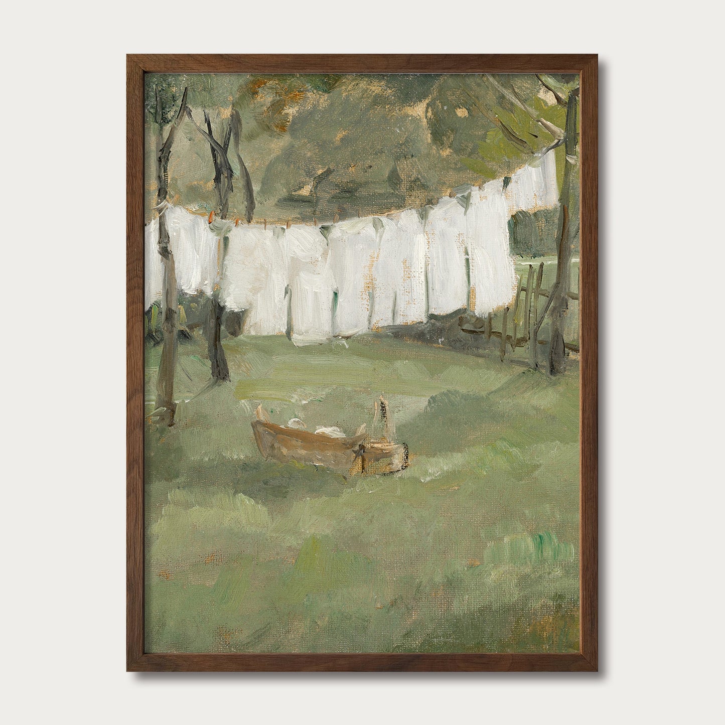 Framed vintage countryside landscape in a walnut wood frame featuring white linens drying outdoors beneath tall trees for farmhouse, French country, and cottage interiors.