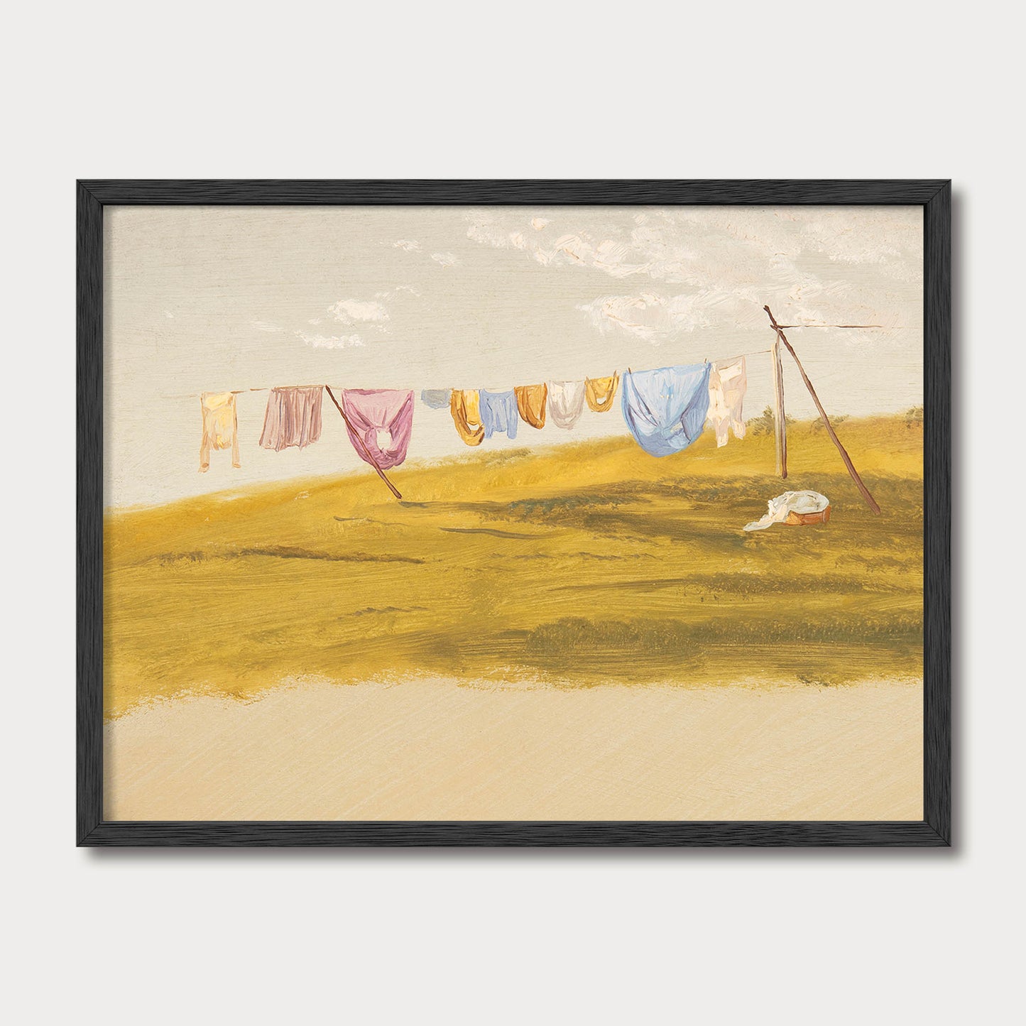 Modern farmhouse laundry room wall art in a black wood frame featuring a vintage countryside clothesline landscape with warm neutral colors.