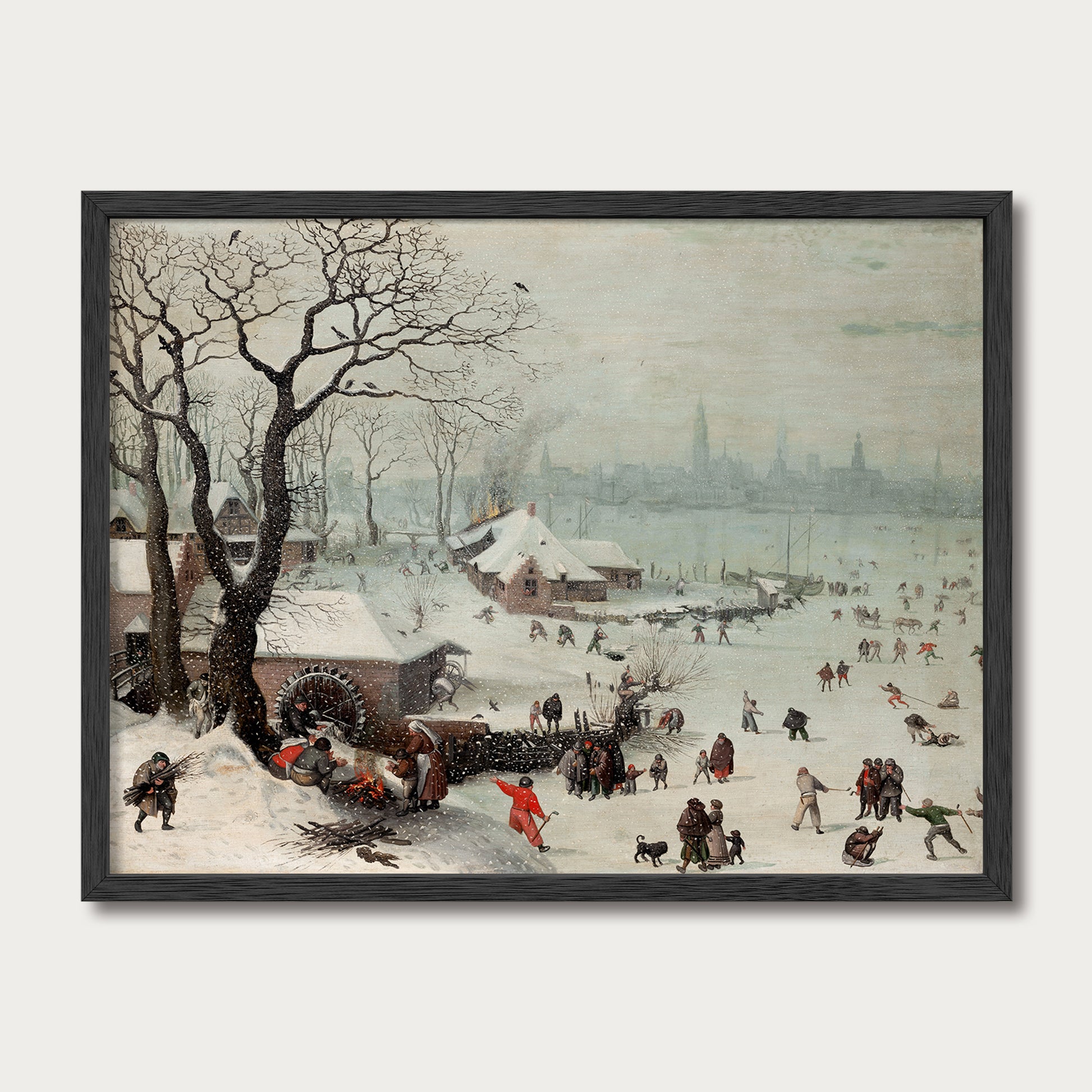 Framed vintage artwork of a winter scene with people skating and sledding on a frozen lake.